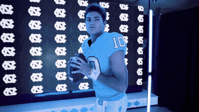 A Football Player In A Blue Jersey With The Number 10 On It GIF