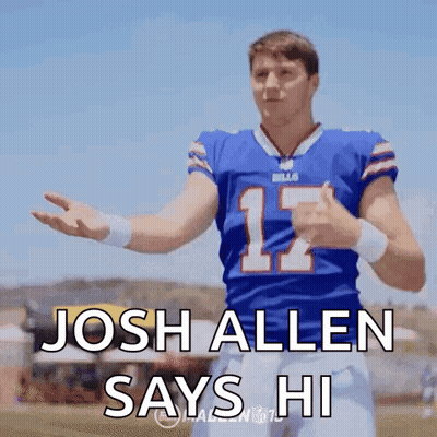 A Football Player In A Blue Jersey With The Number 12 On It Is Giving A Thumbs Up . GIF