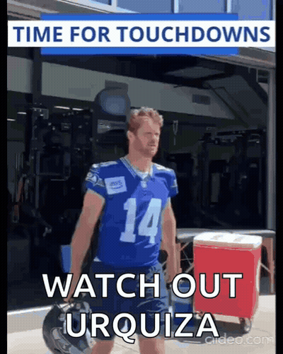 A Football Player In A Blue Jersey With The Number 14 On The Front GIF