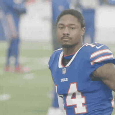 A Football Player In A Blue Jersey With The Number 4 On It GIF