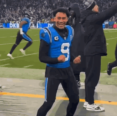 A Football Player In A Blue Jersey With The Number 9 On It GIF