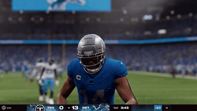 A Football Player In A Blue Uniform With The Number 14 On It GIF