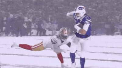 A Football Player In A Buffalo Bills Jersey Is Running With The Ball GIF