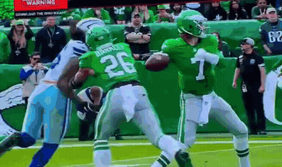 A Football Player In A Green Uniform With The Number 26 On It GIF