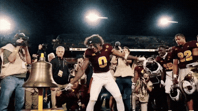 A Football Player In A Maroon Uniform With The Number 9 On It GIF
