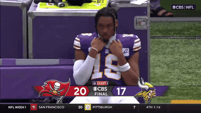 A Football Player In A Purple Jersey With The Number 19 On The Front GIF