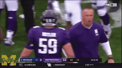 A Football Player In A Purple Jersey With The Number 59 On The Back GIF
