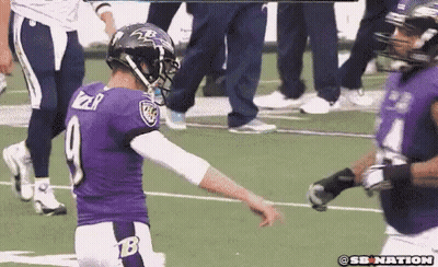 A Football Player In A Purple Uniform With The Number 9 On It GIF