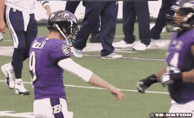 A Football Player In A Purple Uniform With The Number 9 On The Back GIF