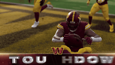 A Football Player In A Red And Yellow Uniform Holds A Ball In His Hands GIF