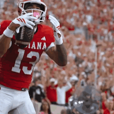 A Football Player In A Red Jersey With The Number 13 GIF