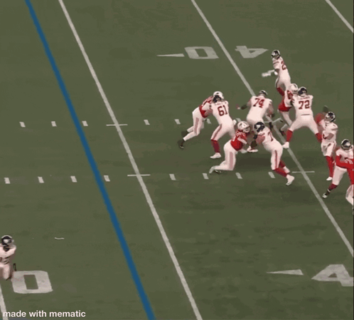 A Football Player In A Red Jersey With The Number 14 On It Jumps In The Air GIF