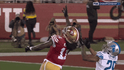 A Football Player In A Red Jersey With The Number 41 On It GIF