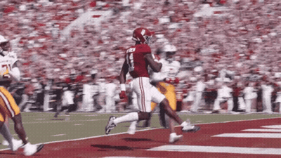 A Football Player In A Red Jersey With The Number 8 On It GIF