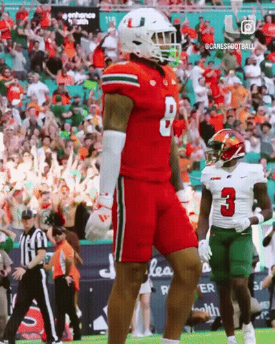 A Football Player In A Red Jersey With The Number 8 On It GIF