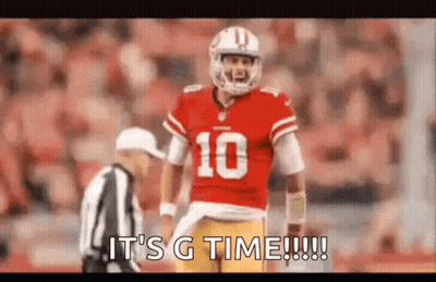A Football Player In A Red Uniform Is Standing Next To A Referee On The Field . GIF