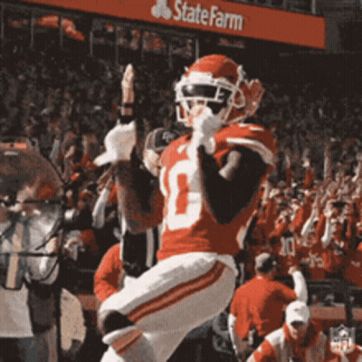 A Football Player In A Red Uniform With The Number 10 On His Jersey GIF