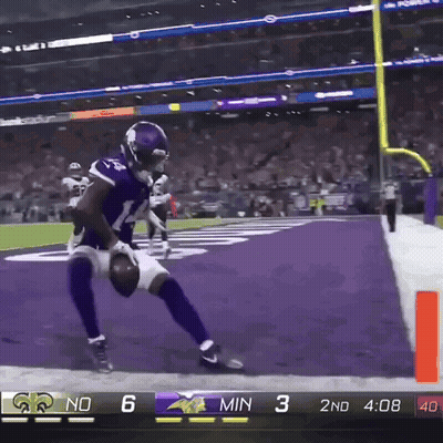 A Football Player In A Vikings Uniform Runs Towards The Goal Line GIF