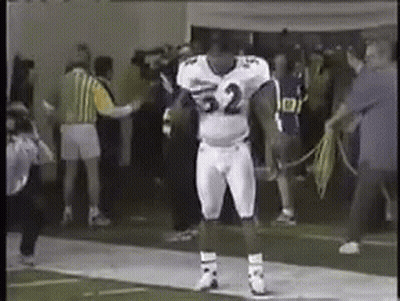 A Football Player In A White Uniform With The Number 32 On It GIF