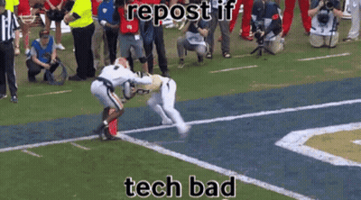 A Football Player Is Being Tackled By Another Player On A Field With The Caption Tech Bad GIF