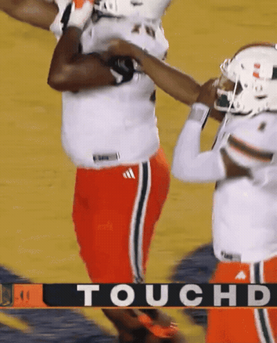 A Football Player Is Being Tackled By Another Player With The Word Touchd On The Bottom GIF