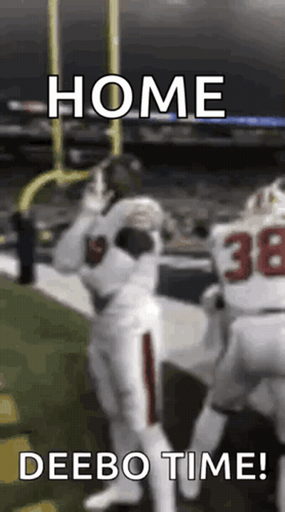 A Football Player Is Catching A Ball On A Field With The Caption `` Home Deebo Time '' . GIF