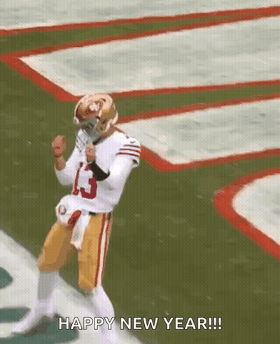 A Football Player Is Dancing On A Field With The Words `` Happy New Year '' Written Below Him . GIF