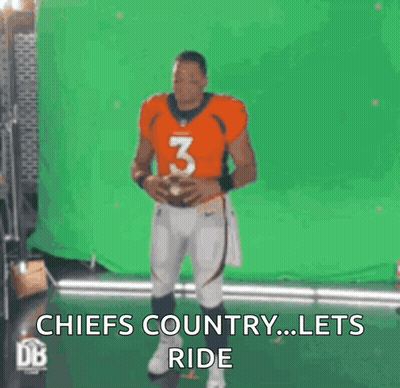 A Football Player Is Holding A Football In Front Of A Green Screen And Says Chiefs Country ... Lets Ride . GIF