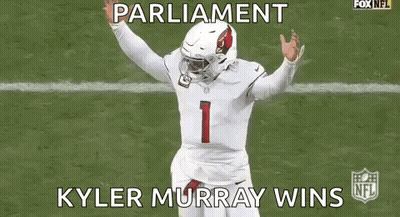 A Football Player Is Running On A Field While Wearing A White Jersey And A Helmet . GIF