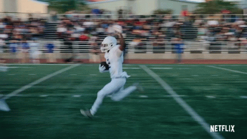 A Football Player Is Running On The Field With A Netflix Logo In The Corner GIF