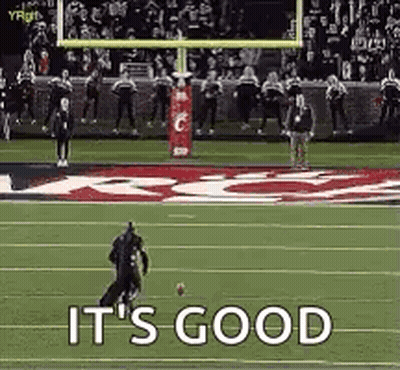 A Football Player Is Running With A Ball On A Field And The Words `` It 'S Good '' Are Visible . GIF
