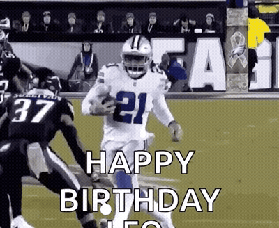 A Football Player Is Running With The Ball On A Field While Another Player Tries To Stop Him . GIF
