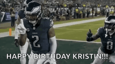 A Football Player Is Running With The Ball On A Field While Giving A Thumbs Up . GIF