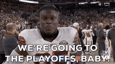 A Football Player Is Standing In Front Of A Crowd And Saying `` We 'Re Going To The Playoffs , Baby ! '' GIF