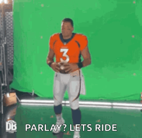 A Football Player Is Standing In Front Of A Green Screen Holding A Football And Saying `` Parlay ? Lets Ride '' . GIF
