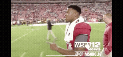A Football Player Is Standing On A Field With A Wsfa12 News Logo On The Bottom GIF