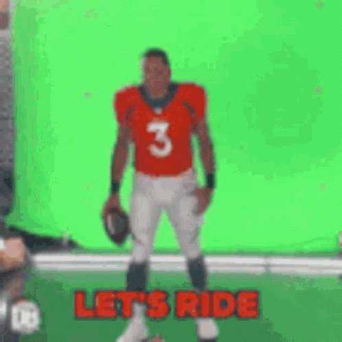 A Football Player Is Standing On A Green Screen With His Arms Outstretched And The Words `` Let 'S Ride '' . GIF
