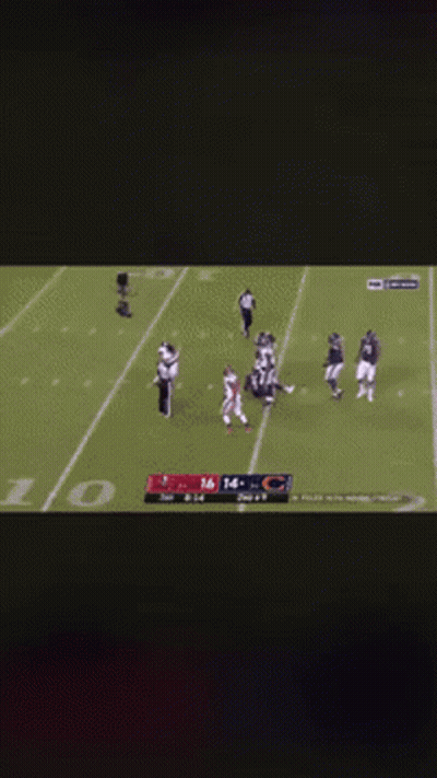 A Football Player Kneeling On The Field With The Number 16 On His Jersey GIF