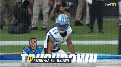 A Football Player Named Amon-Ra St. Brown Is Kneeling Down On The Field GIF