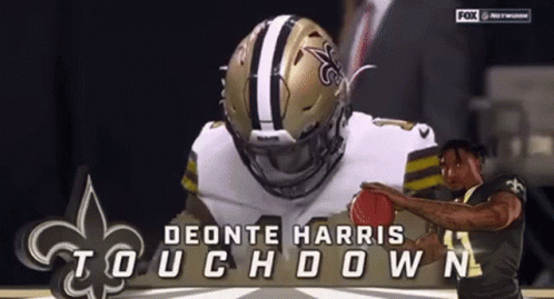 A Football Player Named Deonte Harris Touchdown Is Holding A Football GIF