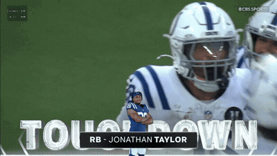 A Football Player Named Jonathan Taylor Is Standing In Front Of A Large Screen GIF