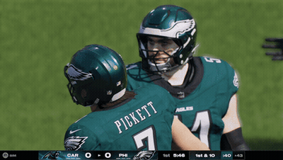 A Football Player Named Pickett Is Hugging Another Player On The Field GIF