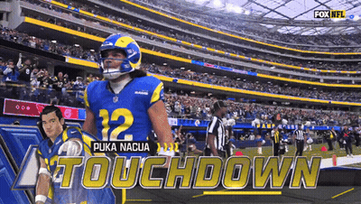 A Football Player Named Puka Nacua Is Standing On The Field GIF