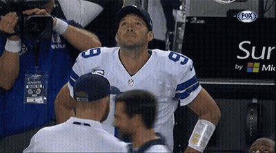 A Football Player Stands In Front Of A Sign That Says Sur By Mic GIF
