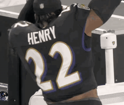 A Football Player Wearing A Black Jersey With The Name Henry On The Back GIF