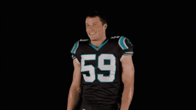 A Football Player Wearing A Black Jersey With The Number 59 On It Is Standing With His Arms Outstretched . GIF