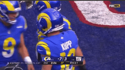 A Football Player Wearing A Blue Jersey With The Name Kupp On It GIF