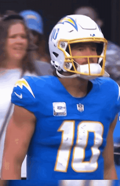 A Football Player Wearing A Blue Jersey With The Number 10 GIF