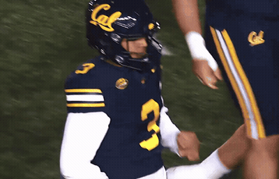A Football Player Wearing A Blue Jersey With The Number 3 GIF