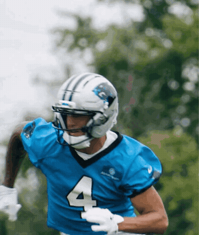 A Football Player Wearing A Blue Jersey With The Number 4 GIF